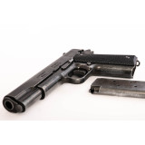 Aged black .45 M1911A1 automatic pistol manufactured by Colt .45 M1...